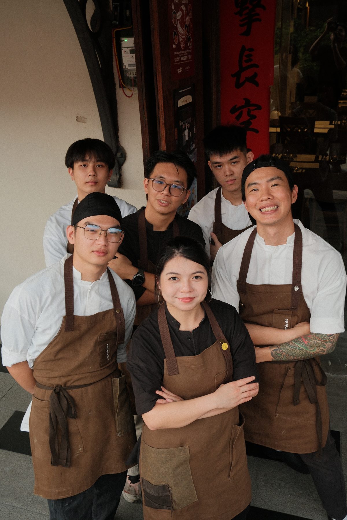 The Rembar team gathered outside the restaurant in George Town