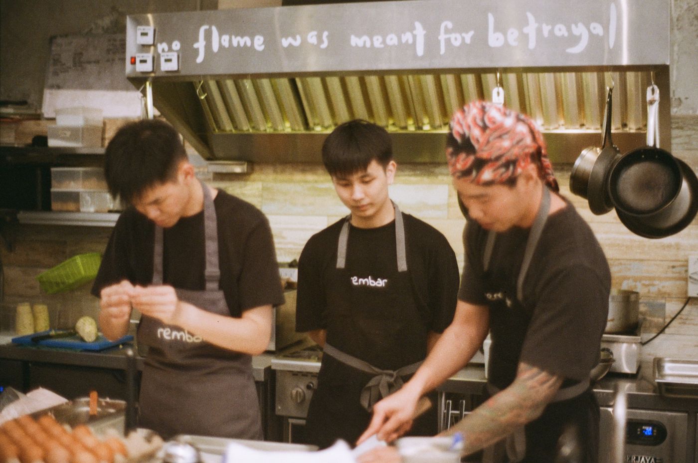 Rembar kitchen staff under the hood signage