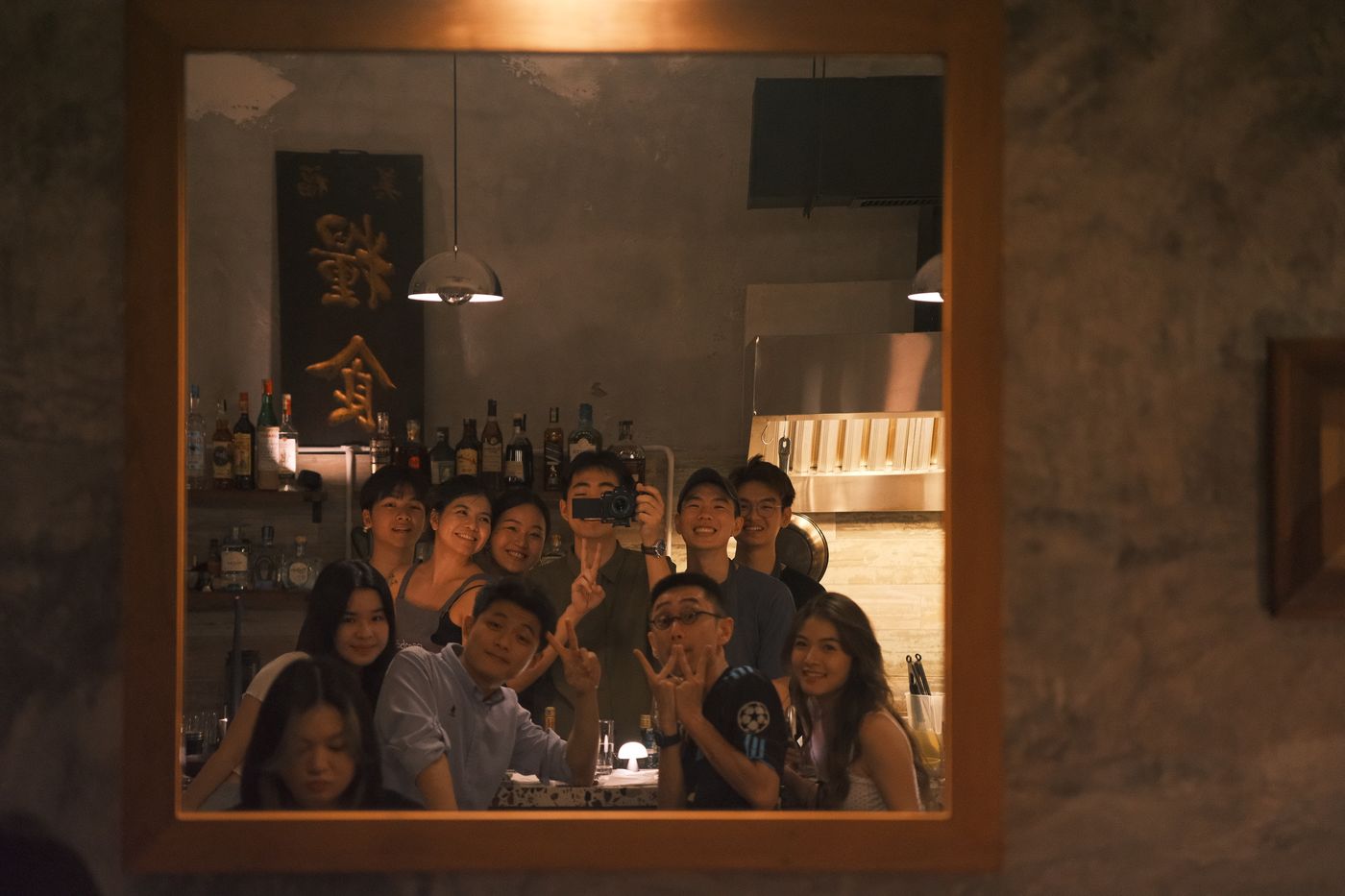 The Rembar team gathered for a group photo in a mirror's reflection