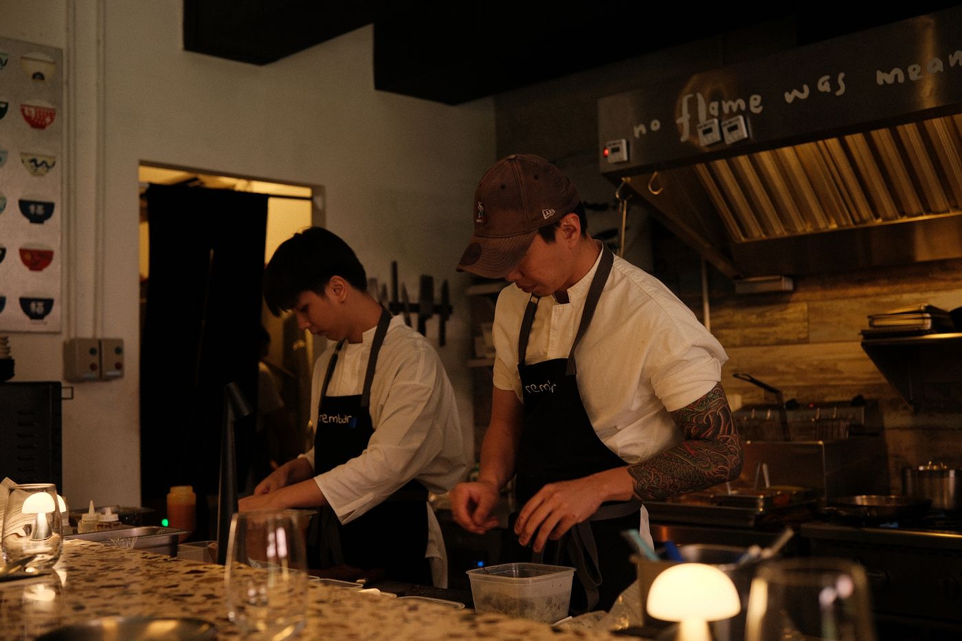 Two cooks working together at the Rembar kitchen counter